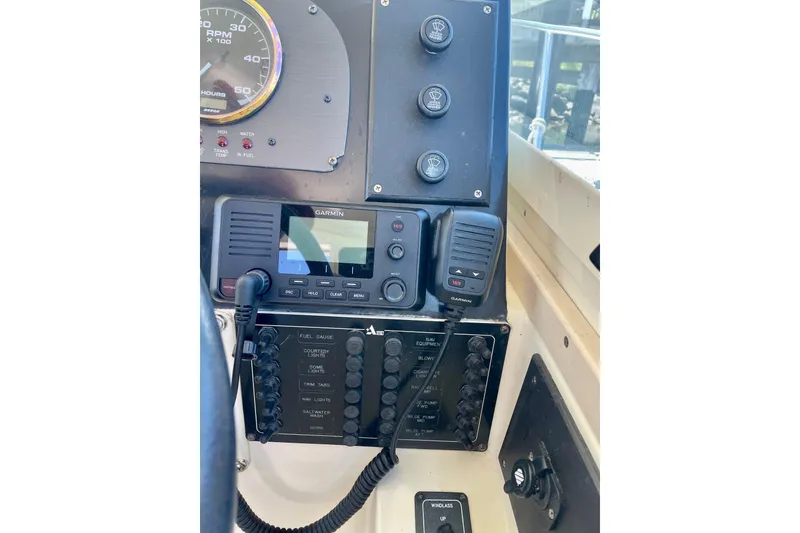 Slide: The Image of Control panel of a 2001 Albin 28 Tournament Express with Garmin marine electronics. - 19