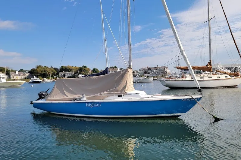 Slide: The Image of Blue 2006 Ensign 23 sailboat moored in a scenic harbor. - 30