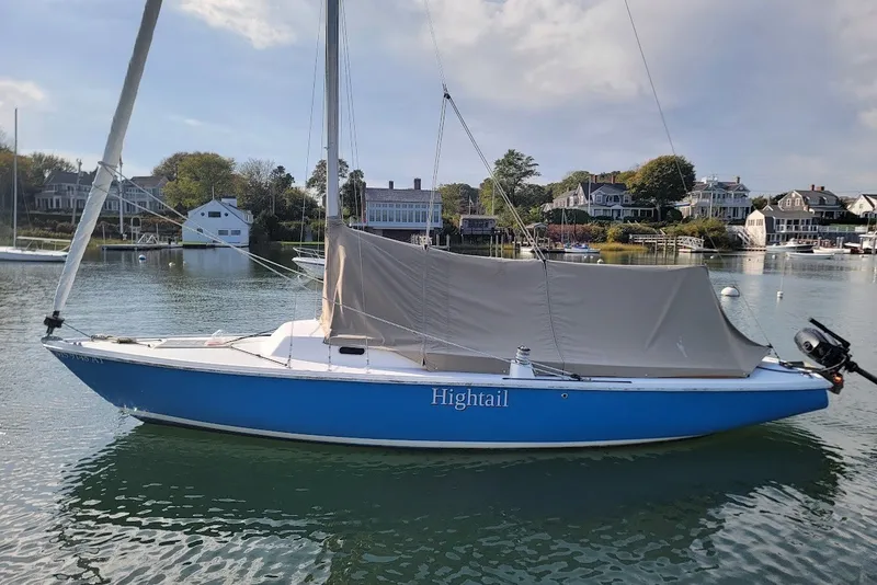 Slide: The Image of Blue 2006 Ensign 23 sailboat "Hightail" docked in a scenic harbor. - 15