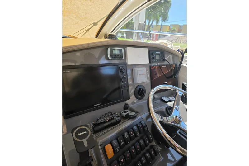 Slide: The Image of Helm of 2015 Pursuit SC 365i Sport Coupe with Garmin display and controls. - 14