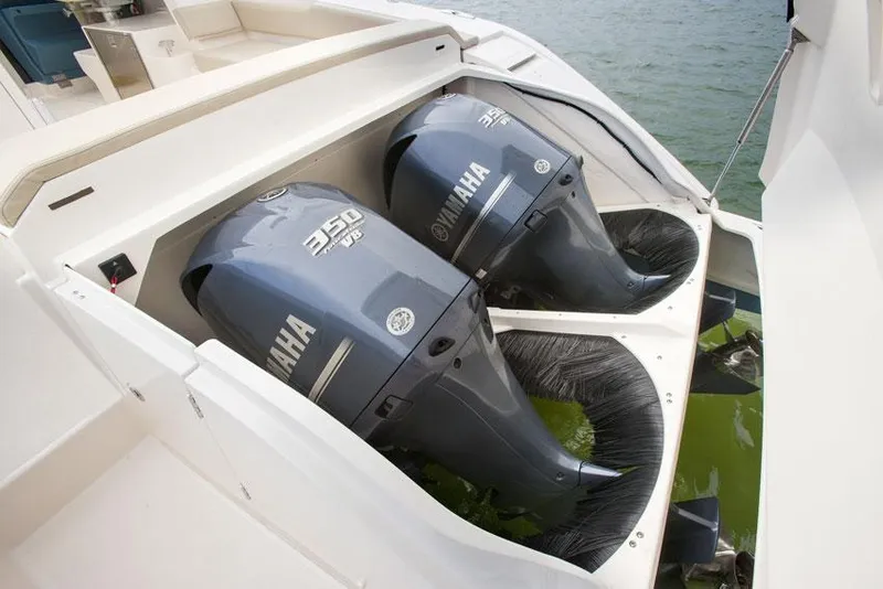 Slide: The Image of Manufacturer Provided Image: Twin Yamaha 350 engines on a 2015 Pursuit SC 365i Sport Coupe boat. - 22