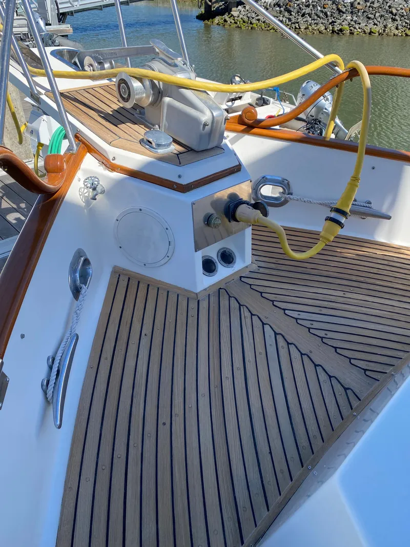 Slide: The Image of 1997 Grand Banks Classic yacht deck with teak flooring and marine equipment. - 44