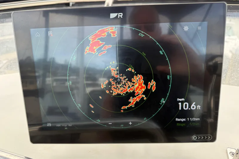 Slide: The Image of Radar display on a 1997 Grand Banks Classic showing depth and range data. - 20