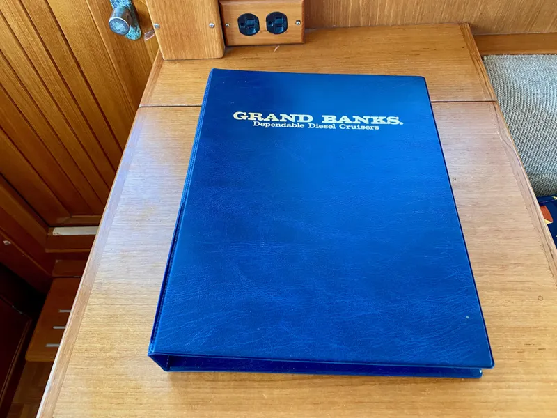 Slide: The Image of Blue Grand Banks manual on wooden surface, 1997 Classic model. - 45