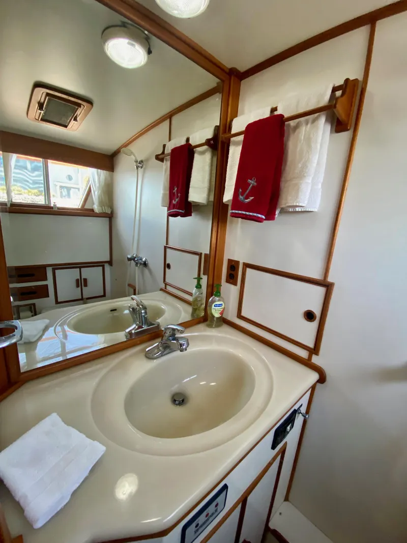 Slide: The Image of Bathroom interior of 1997 Grand Banks Classic yacht with sink and mirror. - 33