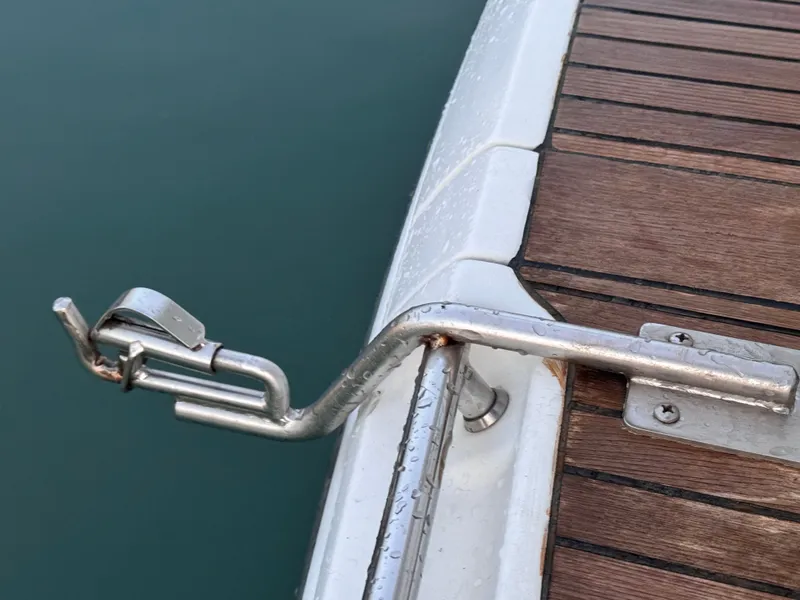 Slide: The Image of Close-up of a stainless steel fitting on a boat with a wooden deck. - 14