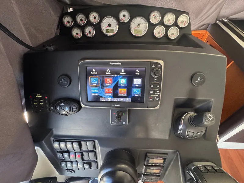 Slide: The Image of The dashboard of a 2017 Jeanneau NC 11 with modern instruments and a navigation system. - 45