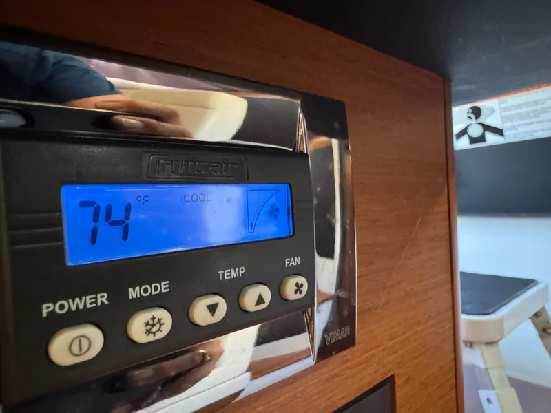 Slide: The Image of Close-up of a climate control display on a 2017 Jeanneau NC 11 boat. - 49