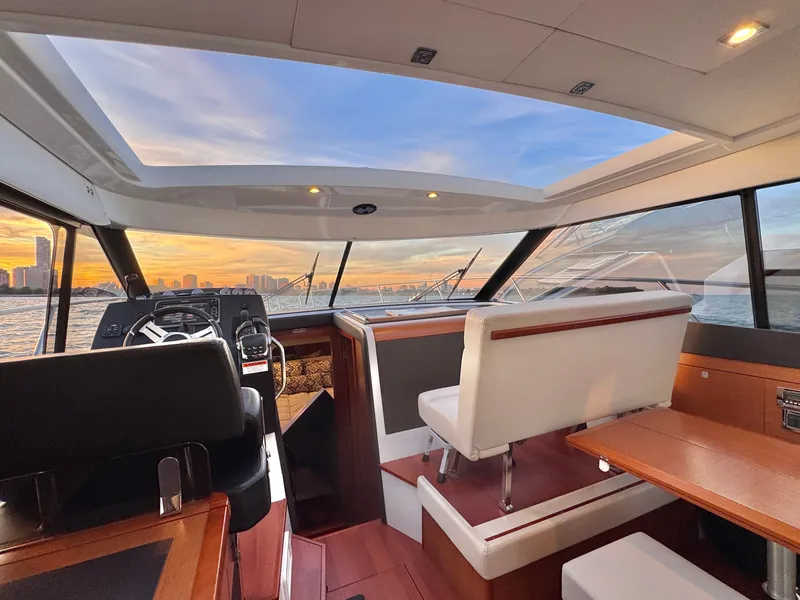 Slide: The Image of Interior of a 2017 Jeanneau NC 11 with modern design and panoramic windows. - 18
