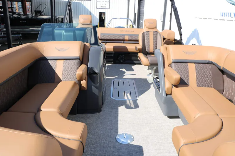 Slide: The Image of The image shows the interior of a 2026 Bennington 22 MSB Tri Toon with luxurious seating. - 29