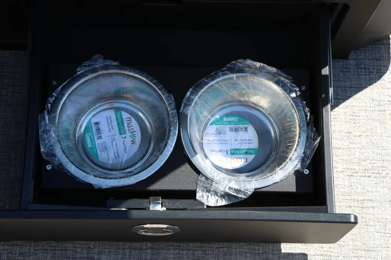 Slide: The Image of Two stainless steel bowls in a drawer on a boat. - 39