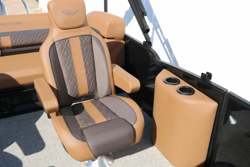 Slide: The Image of Luxurious captain's chair in brown and beige tones with quilted pattern, next to a cup holder. - 41