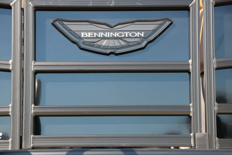 Slide: The Image of Close-up of the Bennington logo on a 2026 22 MSB Tri Toon. - 11
