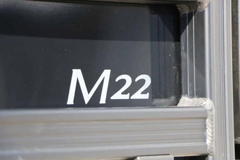 Slide: The Image of Close-up of the "M22" lettering on a 2026 Bennington 22 MSB Tri Toon. - 13