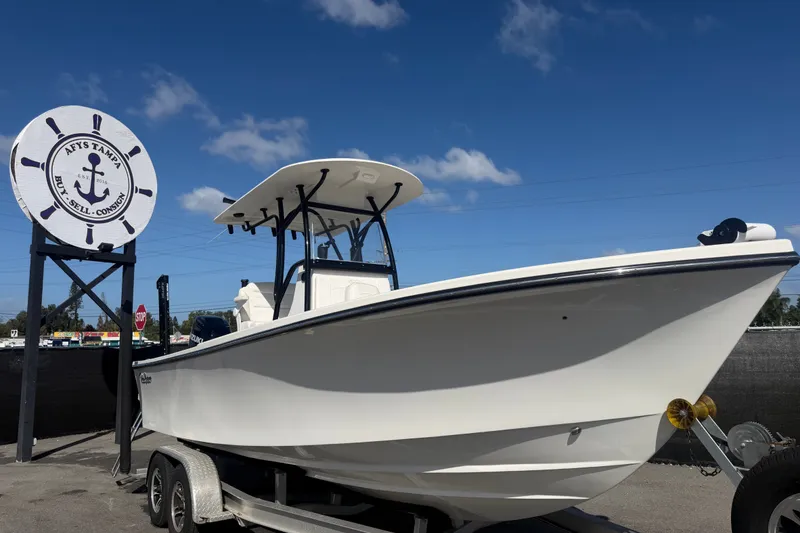 The Image of 2022 Pair Customs 21 Center Console DV boat on trailer under clear blue sky. - 0