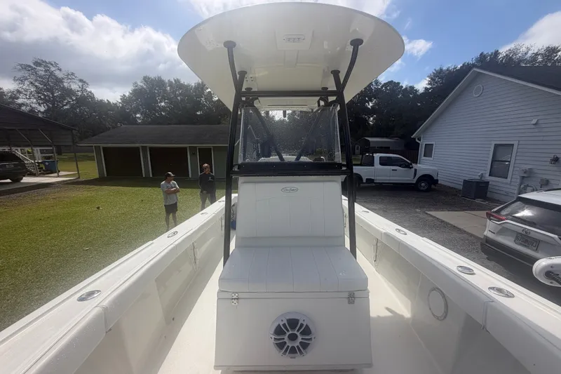 Slide: The Image of 2022 Pair Customs 21 Center Console DV boat, docked outdoors with overcast sky. - 6