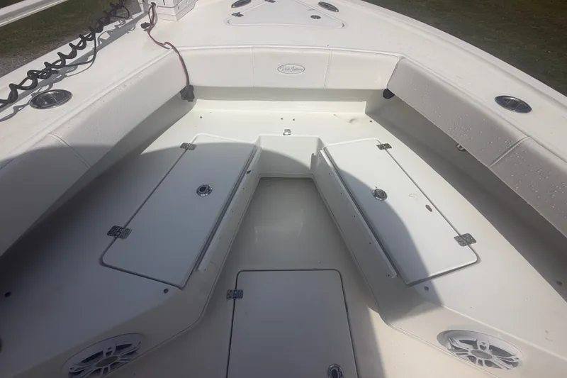 Slide: The Image of 2022 Pair Customs 21 Center Console DV boat interior with storage compartments and seating. - 5