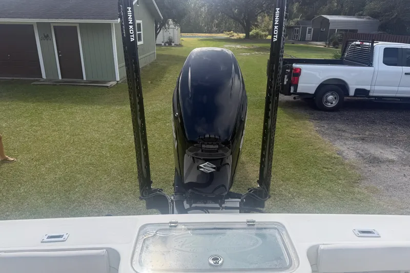 Slide: The Image of 2022 Pair Customs 21 Center Console DV with Suzuki outboard and Minn Kota poles. - 9