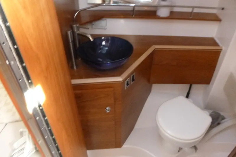 Slide: The Image of Luxurious bathroom in 2025 Cutwater C-288 Coupe with modern sink and wooden cabinetry. - 18