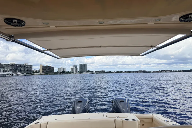 Slide: The Image of 2021 Grady-White Freedom 335 boat with twin engines on a scenic waterfront. - 47