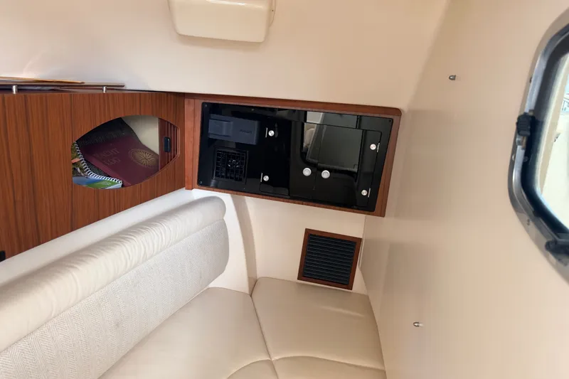 Slide: The Image of Interior cabin of 2021 Grady-White Freedom 335 boat with seating and storage. - 79