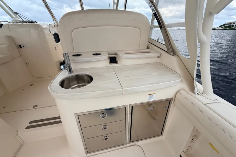 Slide: The Image of Luxury 2021 Grady-White Freedom 335 boat interior with sink and storage. - 31