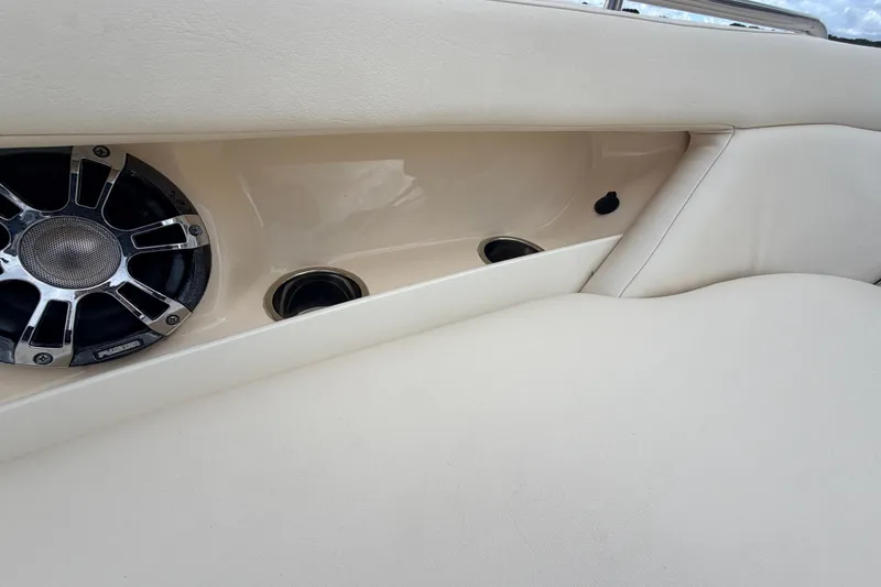 Slide: The Image of 2021 Grady-White Freedom 335 boat interior with speaker and cup holders. - 57