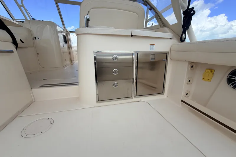 Slide: The Image of 2021 Grady-White Freedom 335 boat interior with stainless steel storage and seating. - 34