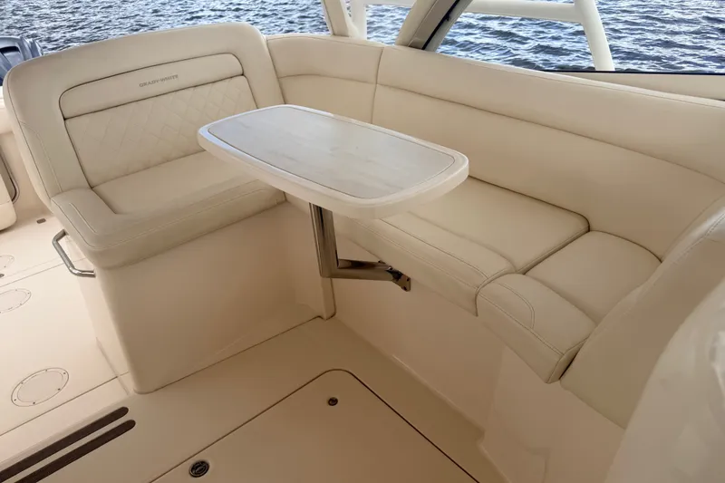 Slide: The Image of Luxurious seating area on a 2021 Grady-White Freedom 335 boat, featuring cream upholstery. - 44