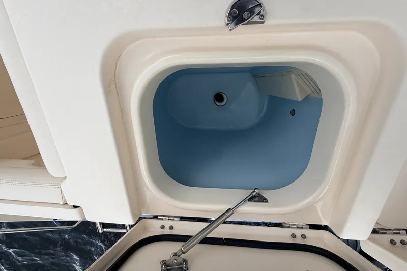 Slide: The Image of Open storage compartment on a 2021 Grady-White Freedom 335 boat. - 41