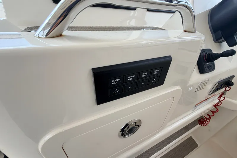 Slide: The Image of Control panel on a 2021 Grady-White Freedom 335 boat dashboard. - 18