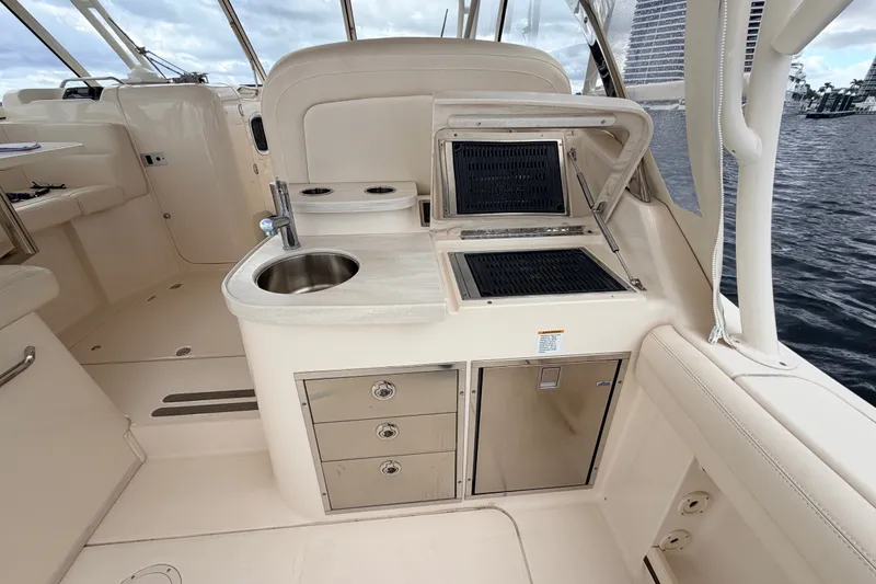 Slide: The Image of 2021 Grady-White Freedom 335 boat interior with sink, grill, and storage drawers. - 33