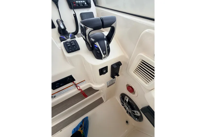 Slide: The Image of Helm controls of 2021 Grady-White Freedom 335 boat, featuring modern steering and electronics. - 14