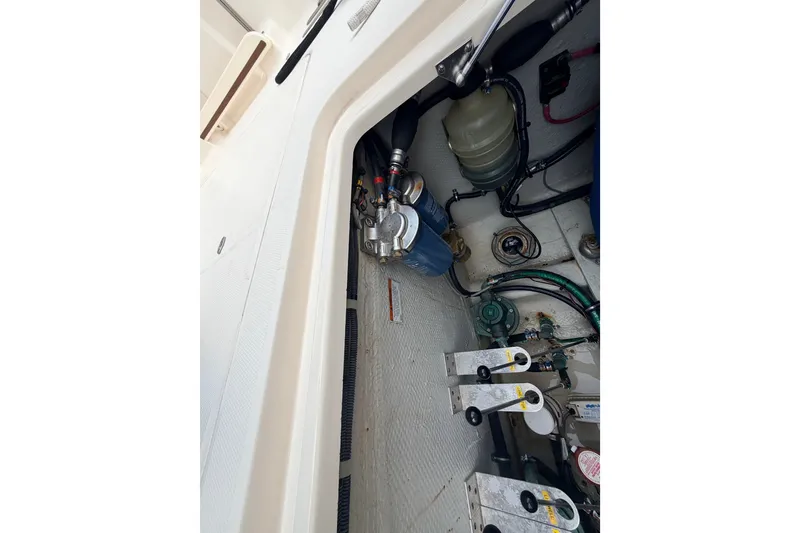 Slide: The Image of Engine compartment of 2021 Grady-White Freedom 335 boat, showcasing mechanical components. - 62