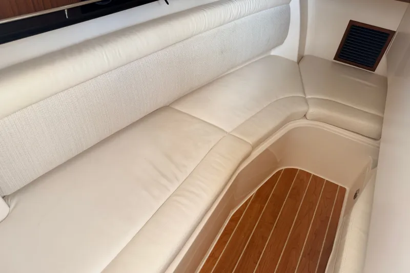 Slide: The Image of Luxurious seating area on 2021 Grady-White Freedom 335 boat with wooden flooring. - 78