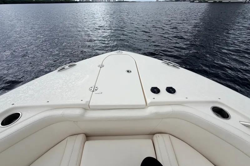 Slide: The Image of Bow view of 2021 Grady-White Freedom 335 boat on calm water. - 25