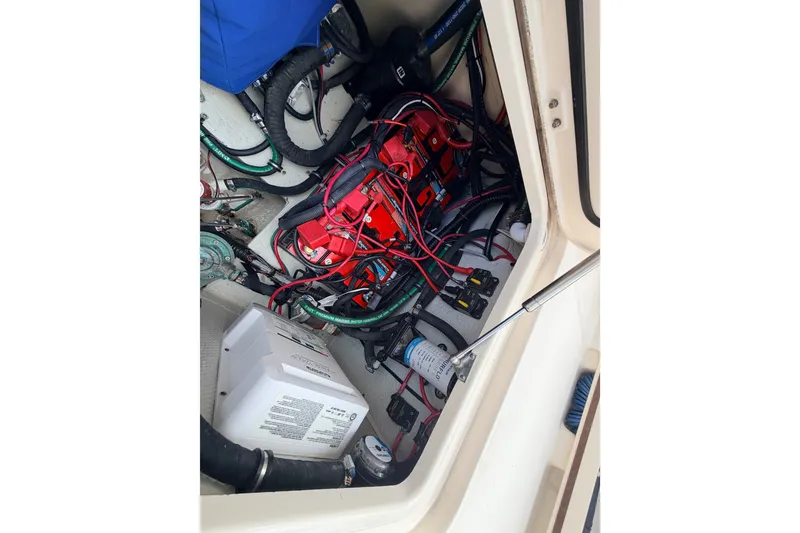 Slide: The Image of Electrical system inside 2021 Grady-White Freedom 335 boat, featuring wiring and components. - 64