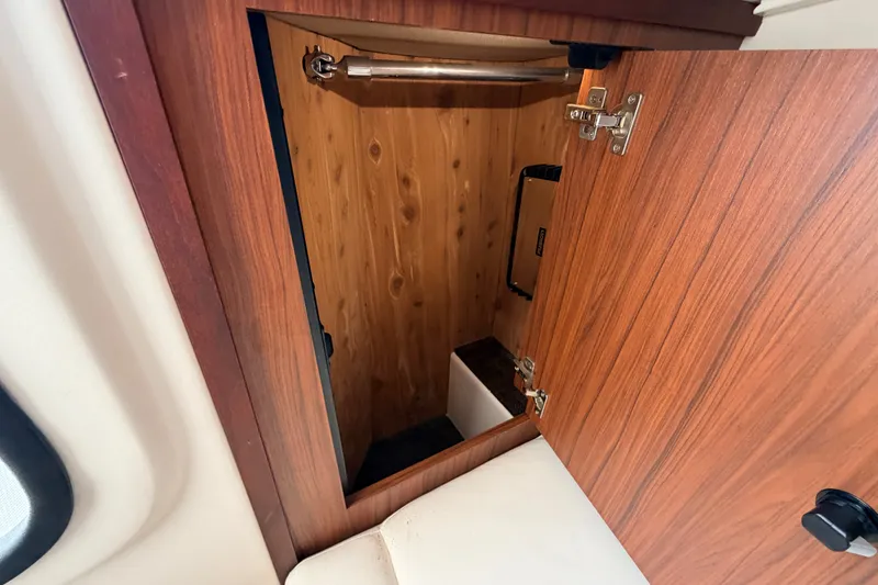 Slide: The Image of Wooden storage compartment inside 2021 Grady-White Freedom 335 boat. - 51