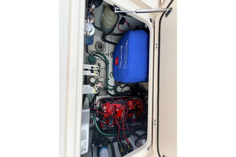 Slide: The Image of Engine compartment of 2021 Grady-White Freedom 335 boat, showcasing wiring and components. - 60