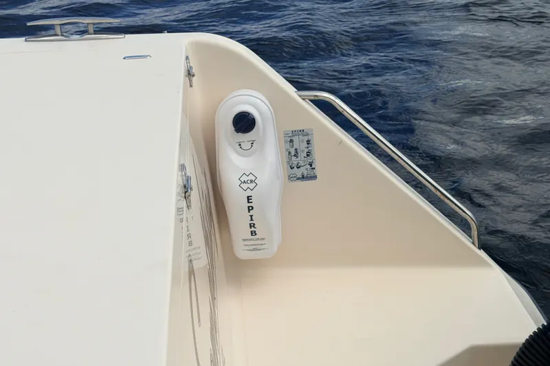 Slide: The Image of 2021 Grady-White Freedom 335 boat with EPIRB device, ocean background. - 71