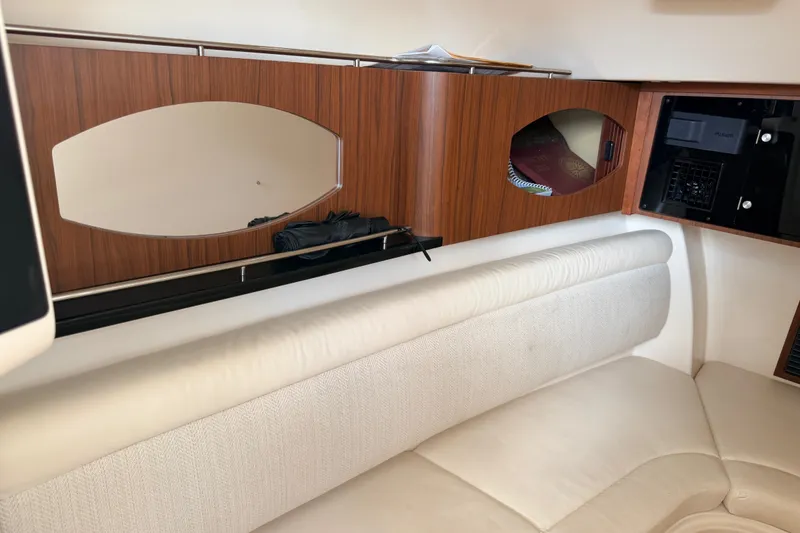 Slide: The Image of Interior of 2021 Grady-White Freedom 335 boat with wood paneling and white seating. - 80