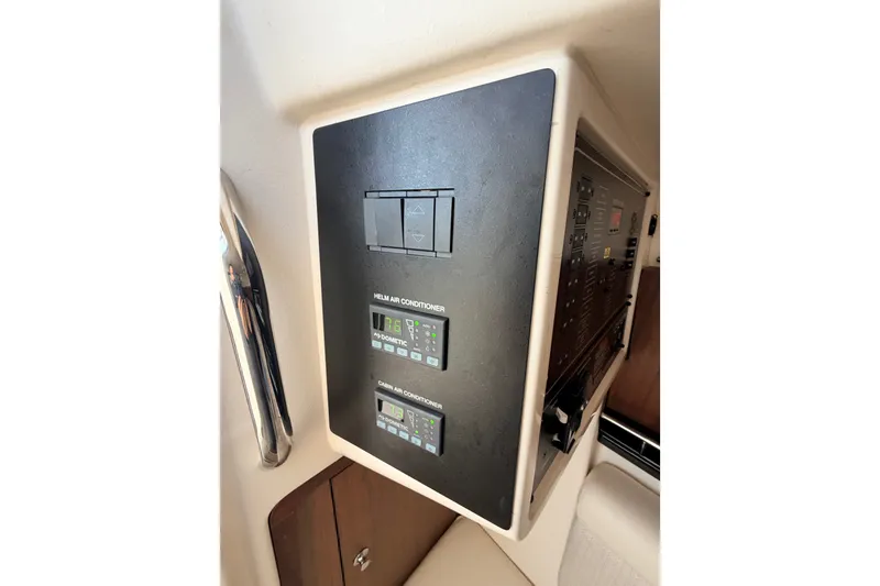 Slide: The Image of Control panel of 2021 Grady-White Freedom 335 boat, featuring air conditioning controls. - 54