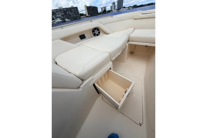 Slide: The Image of 2021 Grady-White Freedom 335 boat interior with open storage compartment. - 56