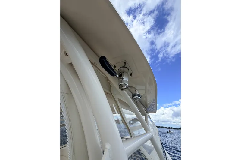 Slide: The Image of 2021 Grady-White Freedom 335 boat detail with clear sky and water view. - 49