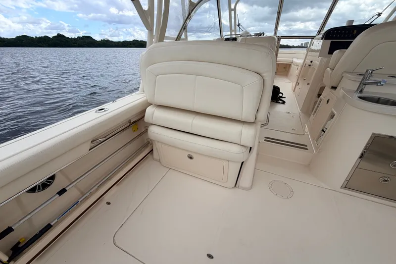 Slide: The Image of 2021 Grady-White Freedom 335 boat interior with plush seating and sleek design. - 29