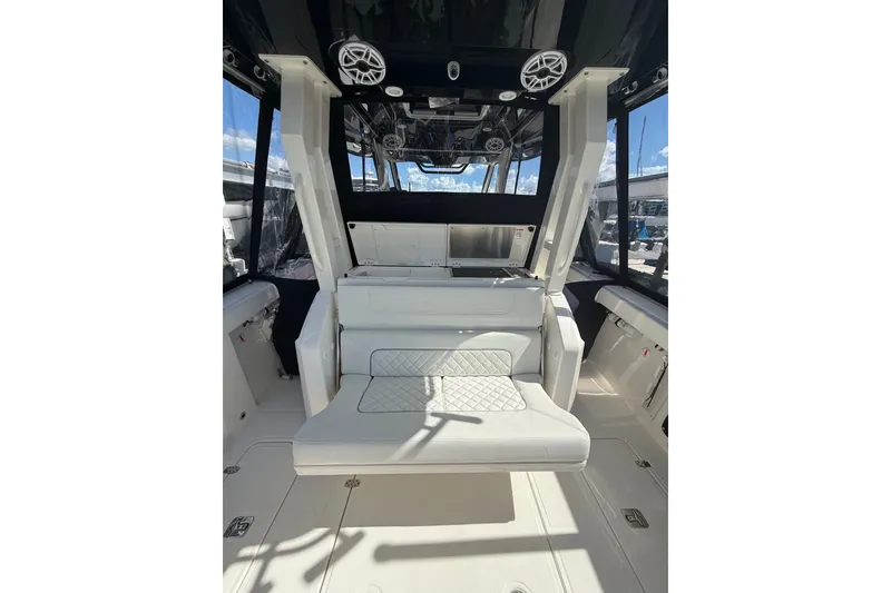 Slide: The Image of 2025 Pursuit S 328 Sport boat interior with luxurious seating and modern design. - 5