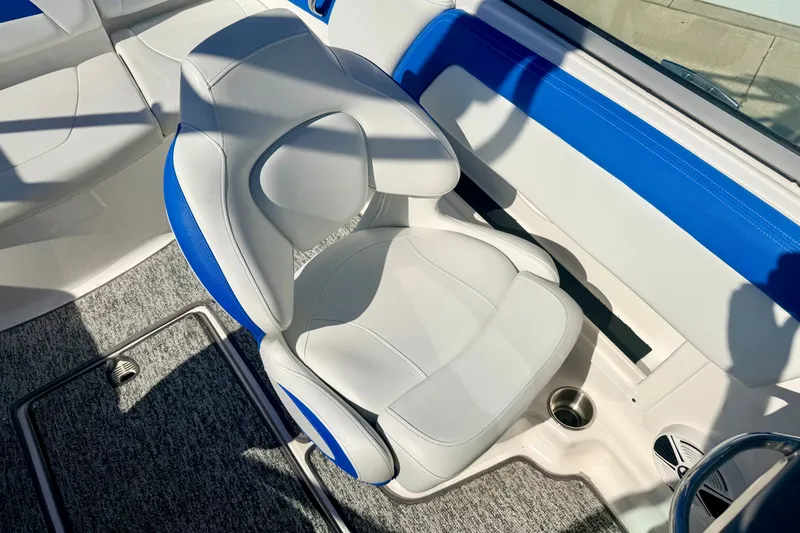 Slide: The Image of 2017 Chaparral 19 Sport H2O boat interior with white and blue seating. - 53