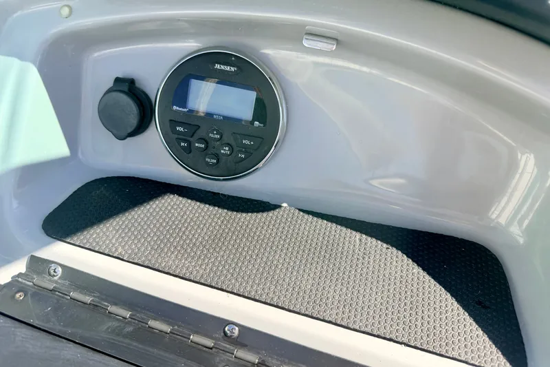 Slide: The Image of 2017 Chaparral 19 Sport H2O boat dashboard with Jensen audio system. - 56