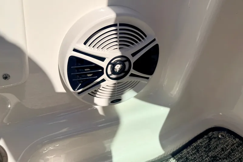 Slide: The Image of Speaker on 2017 Chaparral 19 Sport H2O boat, white interior detail. - 57