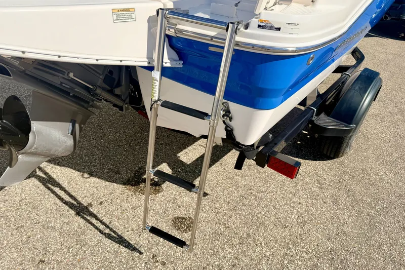 Slide: The Image of 2017 Chaparral 19 Sport H2O boat with ladder and trailer, rear view. - 22